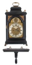 English ebonised double fusee bracket clock with wall bracket, the 7" brass arched dial signed