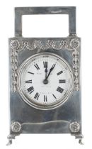 Good French silver cased carriage clock striking on a gong, the 2" white dial and clock base