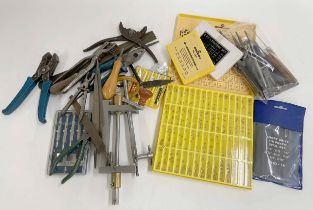 Small quantity of clock tools including; a mainspring winder, files and pliers etc