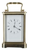 French carriage clock striking on a bell, within a corniche brass case, 7" high (key)