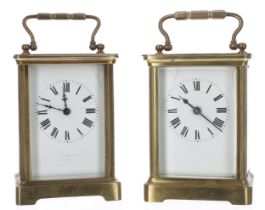 Two similar carriage clock timepieces within corniche brass cases, both 5.75" high (one key) (2)