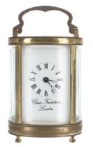 Chas. Frodsham of London oval carriage clock timepiece, within a bevelled glazed gilded brass
