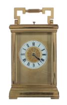 French repeater carriage clock striking on a gong, the 2.25" white chapter ring enclosing a filigree