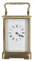 Carriage clock timepiece within a corniche brass case, 6.75" high