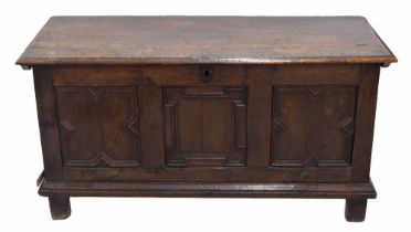 18th century triple paneled oak coffer, the hinged cover enclosing an open interior, over a
