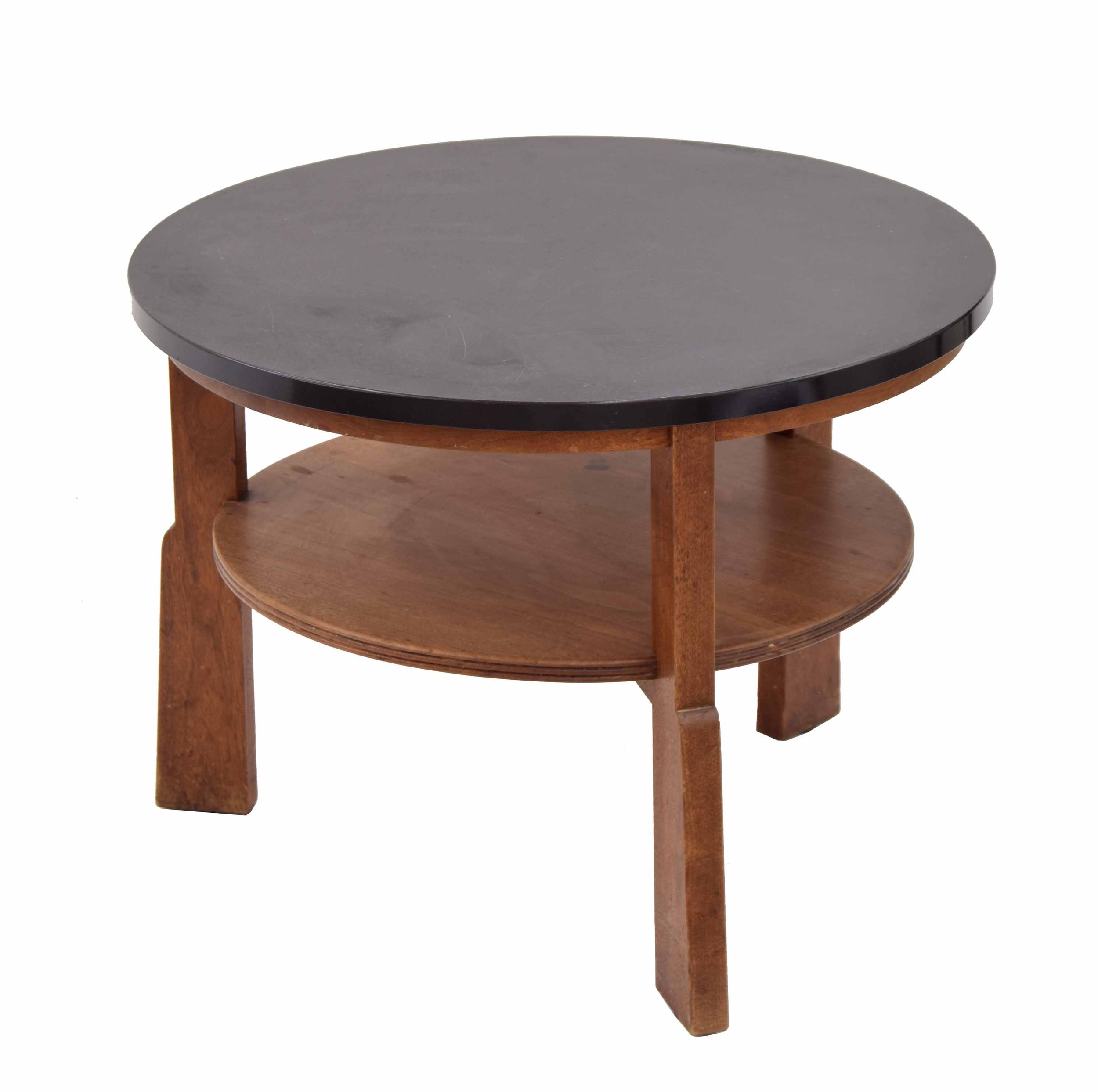 Gordon Russell walnut circular low coffee/book table, the plain top over a circular undertier,