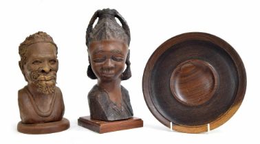 Two carved wooden figural bust sculptures of an African tribal lady and gentleman, tallest 15" high;