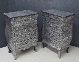 Pair of Arabic style embossed silvered metal covered bedside chests of four drawers, 21" wide, 13"