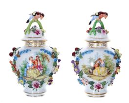 Pair of Dresden Potschappel porcelain jars with covers, each cover with a bird perched on the