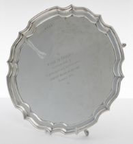 Elizabeth II silver salver, raised on four hoof feet, bearing a presentation inscription to the