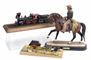 Small scale model of the Wells Fargo U.S postal stagecoach with four horses, mounted on a dust track