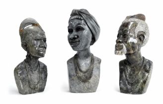 Three carved stone bust statues of African tribal figures, including on signed E N Ndoro (at fault