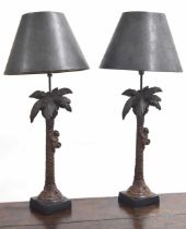 Pair of 'Austin Sculpture Home Collection' resin table lamps, modelled as monkeys climbing palm