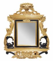 Large and impressive gilt and ebonised wall mirror, the bevelled rectangle glass within a frame