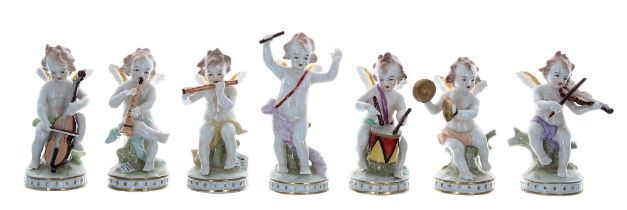 Set of seven Sitzendorf porcelain cherub band figures, playing various musical instruments,