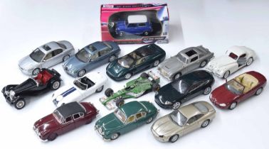 Group of 1:18 scale die cast model automobiles; primarily Jaguar and including by Bburago, Maisto