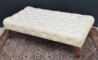 Large rectangular button upholstered stool, in cream, raised on turned legs, 51" wide, 30" deep, 15"