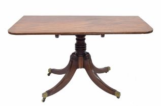 19th century mahogany tilt-top table, the moulded top raised on a turned central support over four