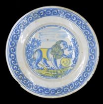 Dutch Delft pottery plate, decorated with a blue lion on a white ground highlighted in yellow to the