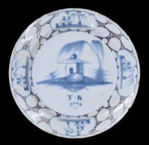 English Delft pottery plate, possibly Bristol, centrally decorated with a blue house under a tree on