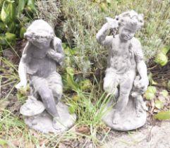 Pair of small lead figural statues, depicting two of the four seasons, of a putti figure with
