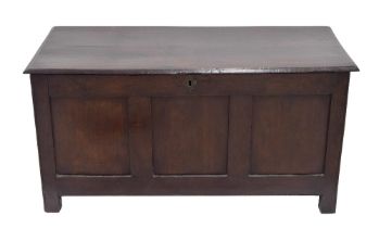 18th century oak triple panelled coffer, the hinged top enclosing an open interior with candle