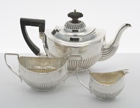 Victorian silver bachelors three piece tea set, of oval form with half gadrooned body, comprising