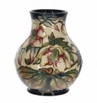 Moorcroft 'Hellebore' pattern vase, bearing a factory stamp, the artists initials and the 2002