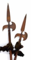 Pair of 19th century poleaxes, on oak poles and each engraved 'G W 1872' to the steel heads, 95"