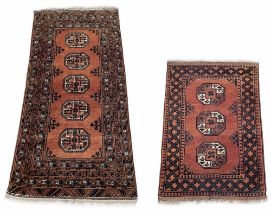 Bokhara pattern rug, decorated with five medallions within multiple repeated geometric borders on
