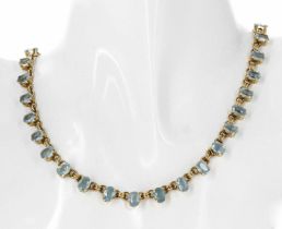 Attractive aquamarine Riviére yellow gold necklet, set with thirty-six oval facetted aquamarine