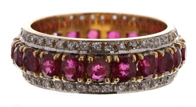 Good 18ct yellow gold ruby and diamond full eternity ring, the a centre band of rubies between