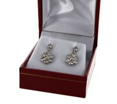 Pair of 18ct white gold daisy-style diamond set cluster drop earrings