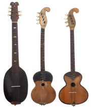Unusual five string instrument with flat back oval banded body perforated with small sound holes,