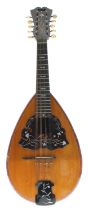 Unusual Neapolitan mandolin with ten strings labelled Umberto Ceccherini, Naples and Sold by the