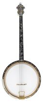 Good Weymann Deluxe tenor open back banjo, with banded resonator, foliate carved heel and