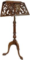 Good Victorian mahogany adjustable duet music stand, the ledges pierced with scrolling foliage