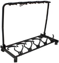 Boston five position folding guitar rack stand; together with two three position guitar hanger trees