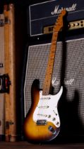1957 Fender Stratocaster electric guitar, made in USA; Body: two-tone sunburst finish, checking
