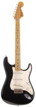 1970s Fender Stratocaster electric guitar; Body: black refinished body, heavy checking, scuffs and