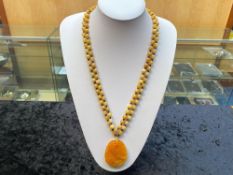 Honey Colour Jade Carved Pendant on Yellow Jade Necklace plus matching necklace;