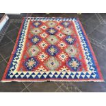 An Aztec Design Woolen Rug, Red Ground, Bright Geometric Decoration, 220 x 190 cm.