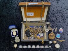 Wooden Box of Collectibles, including a silver locket on a chain, antique base medal, yellow medal,