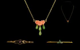 Small Mixed Lot to include two 9ct gold stick pins and a coral floral brooch suspended on a fine
