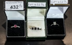 Three 9ct Gold Dress Rings, set with blue, pink and clear gemstones, two with diamond chips. All