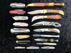 A Tin Containing a Collection of Pocket Knives and Swiss Army Knives, various designs.