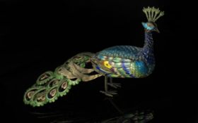 Chinese Export Enamelled Metal Figure of a Peacock of many colours, 3 inches (7.5cms) high x 6.25