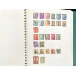 Stamp interest: Green 22 ring Collecta stamp album in slip -case with stamps from Spain and its