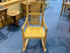 Workshop of Robert Mouseman Thompson of Kilburn (British, 1876-1955) An English Oak Rocking Chair,