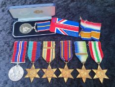 Small Mixed Military Lot to include two Africa Stars one with clasp, Italy Star, Burma Star,